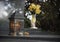 Close up of a lantern made of metal with burning candle on a grave