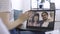 Close up laptop screen view with pleasant Caucasian couple using videoconference app for remote call with family