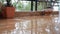 Close-up, large, heavy drops of rain fall with a spray. Water splashes on the floor. Big drops from the rain on the