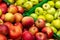 Close-up large, selective, colorful green and red apples on the