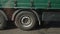 Close-up of large wheels and tires of a truck driving along the highway. Cargo transportation, delivery of cargo. Ukraine, Kiev 06