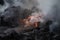 close-up of lava flow, with smoke and steam rising from the molten rock