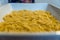 Close up layer of fusilli pasta in baking ceranic tray