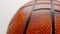Close-up of a leather basketball, white background