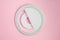 Close-up LED selfie circular ring light lamp on pink background. Clip-on flash light camera phone
