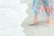 Close up leg lifestyle woman in long dress feeling relax and  happy on the tropical sand beach