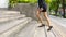 Close up legs of businesswoman walking stepping up on stair in outdoor pedestrian walk way.Business life success and grow up