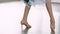 Close-up of legs of a girl in ballroom dances. Slow motion