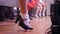 Close-up of the legs of a group of women dancing traditional Irish dances. Dance ensemble legs