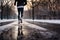 Close-up at legs of a male runner jogging in a park cover by snow.