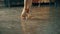 Close-up of the legs of a man and a woman dancing a pair of ballroom dance in the room. Dance moves of the tango.