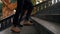 Close up legs of man and woman walking up on stairway. Feet of unrecognizable young couple climb old retro stairs of