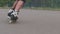 Close-up legs of teenagers. Riding roller skating down the street.