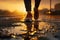 Close up on legs of a woman running on sunny morning after the rain. Runners legs on a sunrise