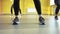 Close-up of legs of women doing pilates group workout in studio.