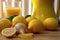 close-up of lemon halves and a juicer