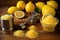 close-up of lemon halves, juicer, and sugar on a wooden table