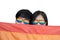 Close-Up on Lesbian Couple Face with Rainbow Glasses under LGBTQ Flag