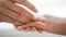 Close up of lesbian couple hands with wedding ring