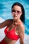 Close up lifestyle portrait of Cute girl swimming in pool, traveling and enjoy her summer vacation, perfect skin,trendy