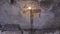 Close up for lighted church candle standing in front of the cement wall near the icon, religion concept. Footage. The