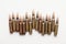 Close up of a line of bullets against a white background