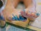 Close up of little baby`s toes and toenails, 2 years old, being painted, messy, dirty