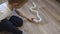 Close-up of a little boy playing with dominoes on the floor of the house.