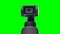 Close up little camera with gimbal on chroma key green screen