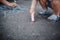 Close up of little girl drawing with chalks on the sidewalk