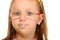 Close up little girl in glasses doing fun saliva bubbles
