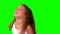 Close up of little girl laughing and turning on green screen