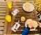 Close up of little kid hands on their way to start a super healthy breakfast on wooden background