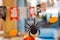 Close up of little scary paper spider lying between orange decorations for Halloween