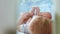 Close-up of a little toddler in a crib laughing side view through a trellis crib changing focus. Happy childhood