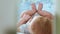 Close-up of a little toddler in a crib laughing side view through a trellis crib changing focus. Happy childhood