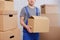 Close up of loader holding a box in warehouse or post office