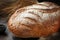 Close-up of a loaf of freshly baked homemade bread on the table. Whole-grain white bread. Healthy food, bread on