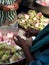 Close up of local woman selling lotus flowers, Trichy, southern India