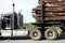 Close up of a logging truck carrying a full load of logs