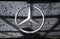 Close up of the logo of Mercedes-Benz on the car front