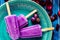 Close up of a Lollipop style grape ice cream on a stick on a vintage plate on a light blue wooden table. Concept of natural and