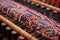 close-up of a loom machine weaving intricate patterns