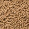 Close-Up Looped Rotation of Compacted Wooden Sawdust Pellets - Natural Cat Litter Filler or Organic Fuel.