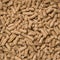 Close-Up Looped Rotation of Compacted Wooden Sawdust Pellets - Natural Cat Litter Filler or Organic Fuel. Big, Long