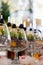 Close up of lot of glasses of fresh cognac or whiskey on bar table.