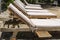 Close up of lounge chairs near swimming pool at a tropical resort spa in island Zanzibar, Tanzania, East Africa