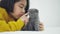 Close up of Lovely Asian girl playing with cute kitten, Pretty girl holding a cat closely indoor