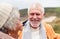 Close Up Of Loving Active Senior Couple Taking A Break As They Walk Along Coastal Path In Winter