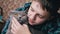 Close up, Loving Boy Hugging, Kisses a Gray British Fluffy Cat in Room